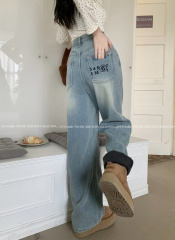 High-waist slim straight-leg jeans with thick velvet and embroidered pockets