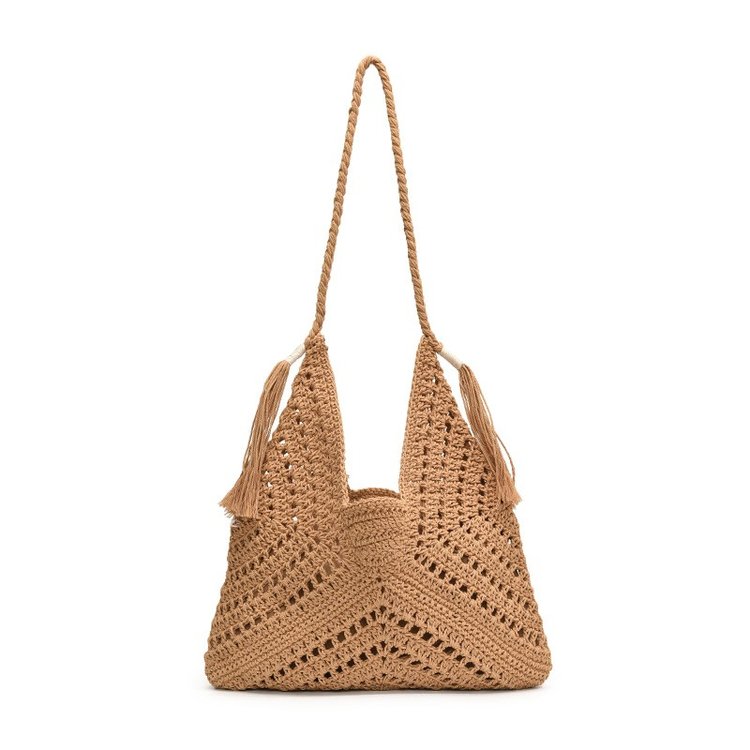 Niche handmade crochet hollow beach vacation literary style straw woven shoulder handbag for women with drawstring inner pocket