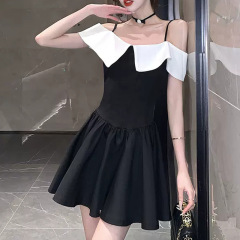French retro chic Hepburn style little black dress with waisted Hong Kong style one shoulder strap dress