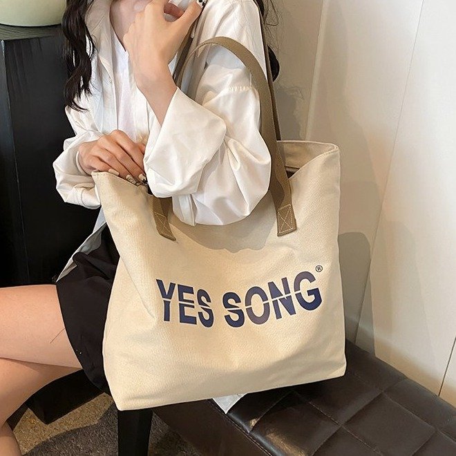 Korean style lazy style large-capacity one-shoulder commuting to work tote bag autumn style trendy letter printed canvas shopping bag