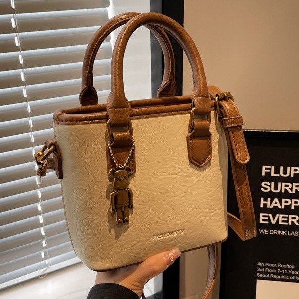 Korean style niche retro high-end hand-carrying fashionable bucket bag for women 2024 autumn and winter new style simple one-shoulder cross-body bag