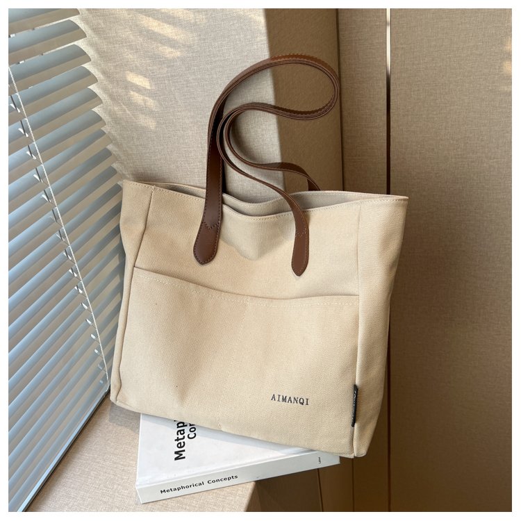Large-capacity canvas bag for women in autumn new contrasting color fashionable shoulder armpit bag commuting all-match tote bag