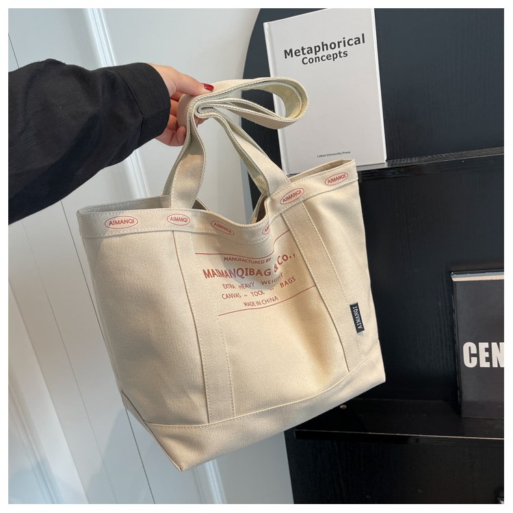 Wholesale canvas bag for women 2024 new style lazy style large capacity handbag commuter bag sense versatile shoulder tote bag