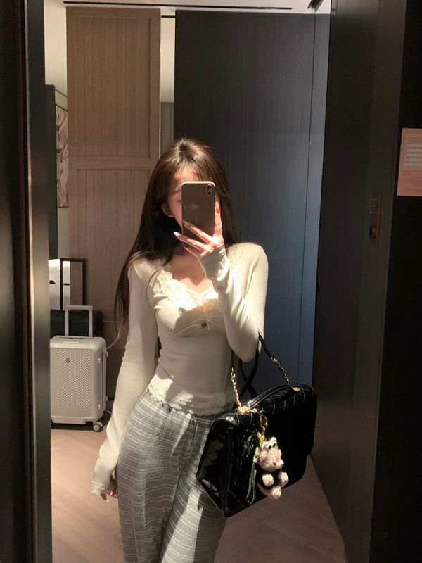 Exquisite lace-paneled stretch-knit top