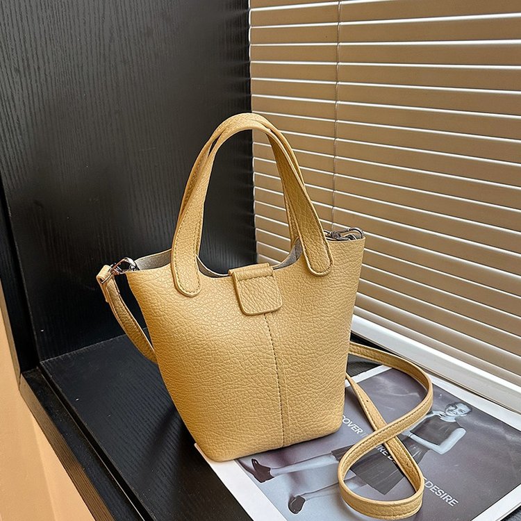 Fashionable and versatile, high-end spring and summer new Korean style diagonal one-shoulder bucket vegetable basket bag with lychee pattern