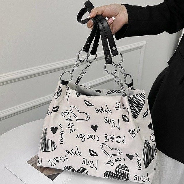 Internet celebrity tote bag class new spring and summer graffiti fashion popular shoulder bag women's large capacity niche commuter bag