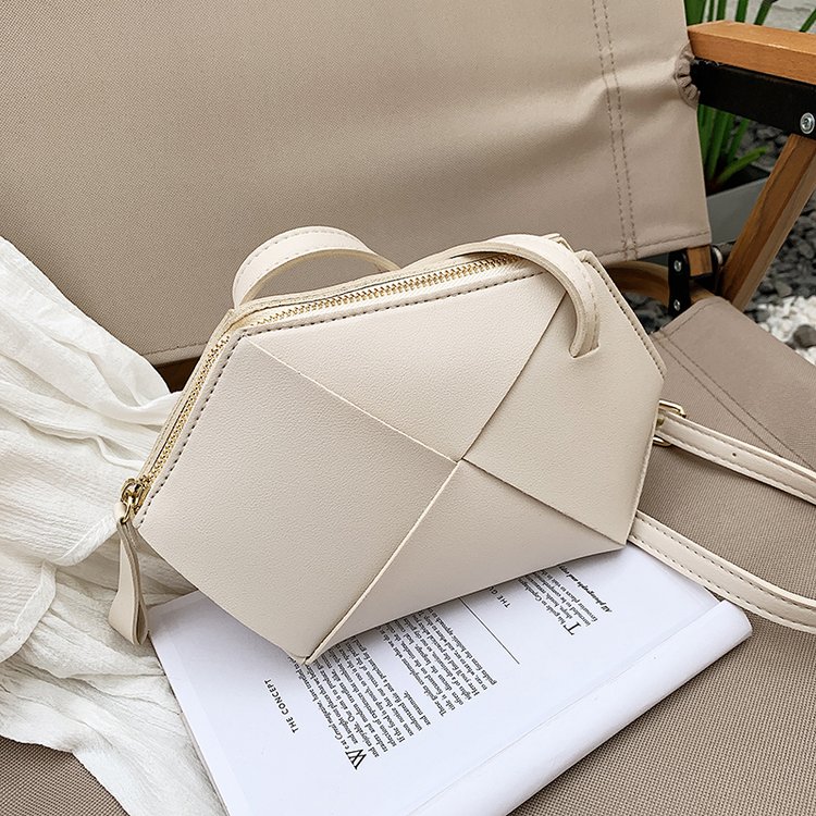 European and American woven shoulder crossbody bag, cowhide fashionable and versatile rice dumpling bag, niche new geometric women's bag manufacturer