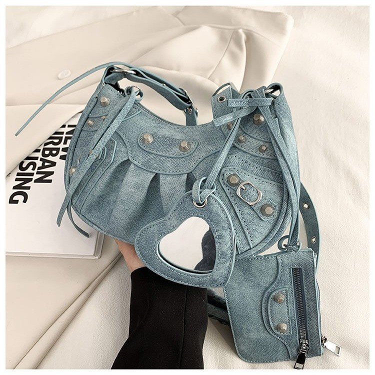 2024 new niche design rivet hot girl style armpit bag versatile three-in-one portable shoulder crossbody crescent bag
