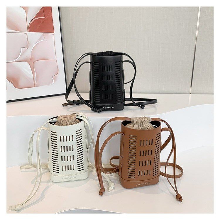 Korean style versatile hollow bucket bag for women, popular texture soft leather shopping crossbody mobile phone bag drawstring single shoulder mother-in-law bag