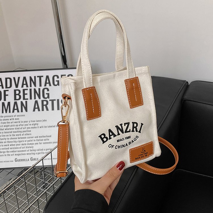 Factory direct sales 16A letter printed literary canvas bag new Korean version Dongdaemun crossbody shoulder bag