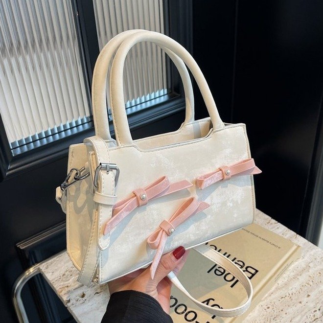 High-end niche bow bag 2024 new Korean style fashion shoulder bag for women, fashionable and versatile hand-held crossbody bag