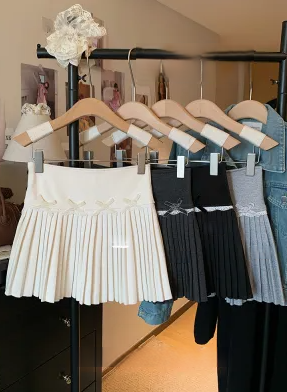 Autumn and winter new style bow woolen pleated skirt women's high-waisted A-line sweet anti-exposure short skirt