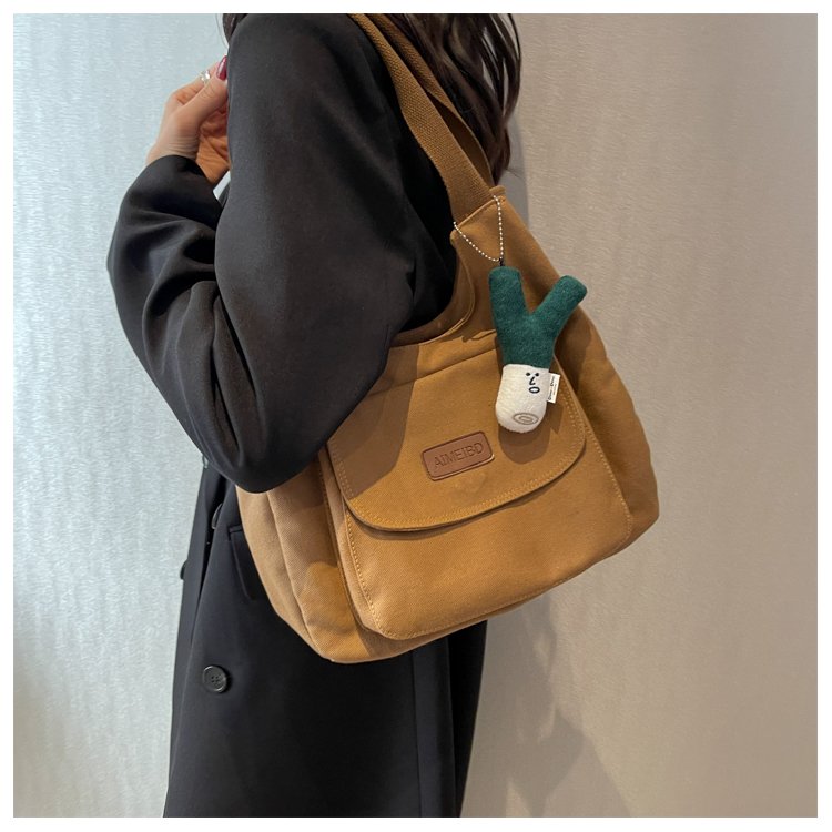 Large-capacity commuting Japanese canvas bag women's retro niche design casual high school college student tote bag