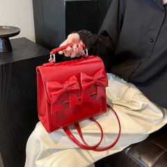 Niche design bow backpack for women 2024 new shoulder bag fashionable crossbody simple handheld backpack