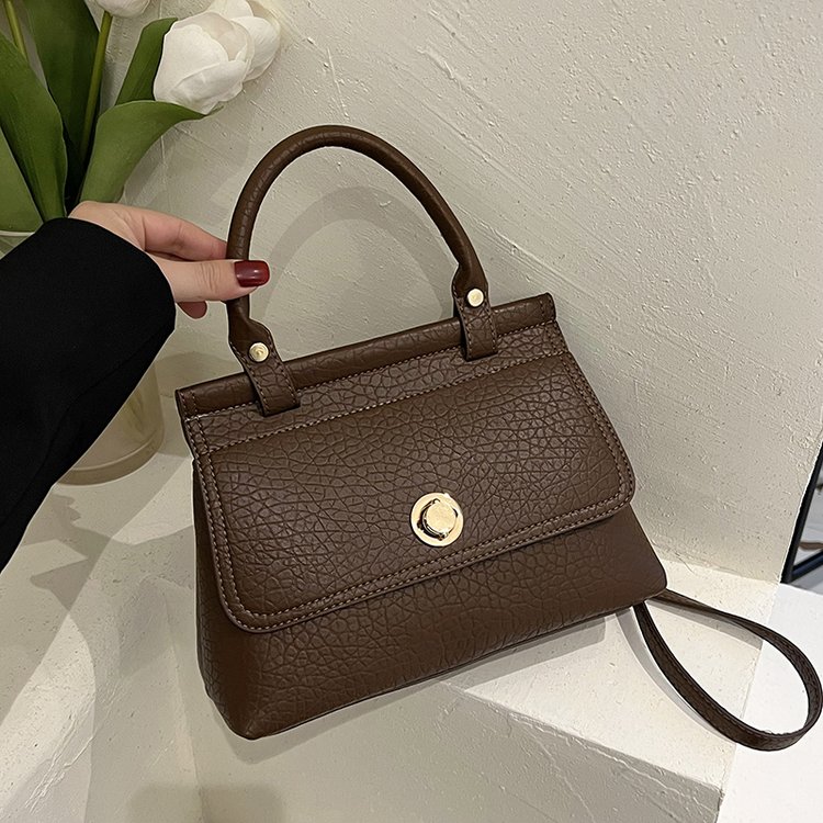 Retro women's niche portable solid color commuter tote bag 2024 new soft leather one-shoulder flip crossbody small square bag