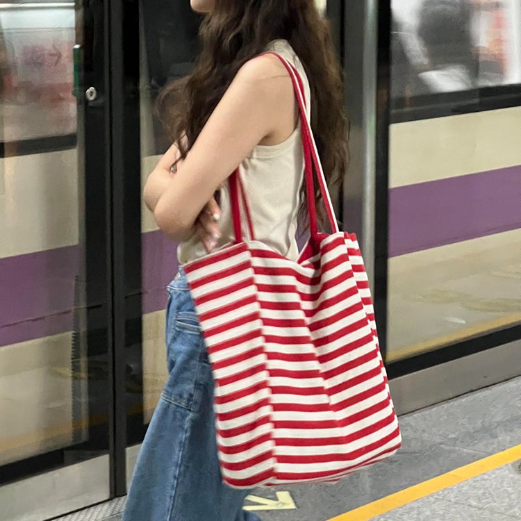 Large-capacity striped canvas bag for women 2024 new niche embroidery lazy style commuter portable shoulder tote bag