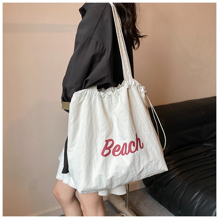Japanese lazy style letter printed shoulder bag casual versatile portable drawstring nylon bag large capacity tote bag