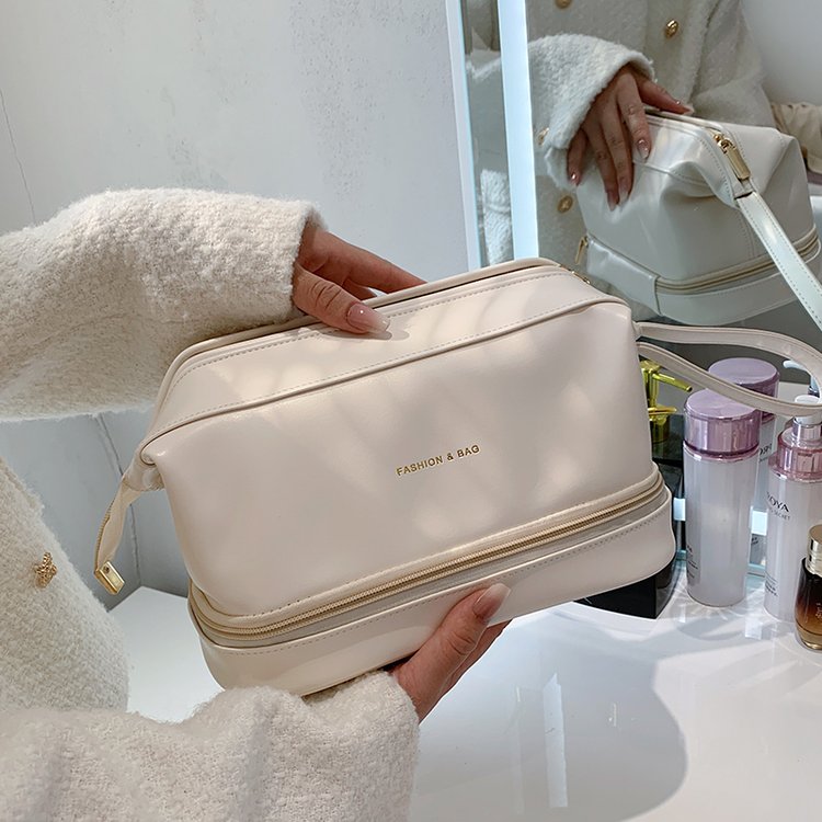New PU leather double layer cloud cosmetic bag, high-looking portable toiletry bag, large capacity women's storage bag wholesale