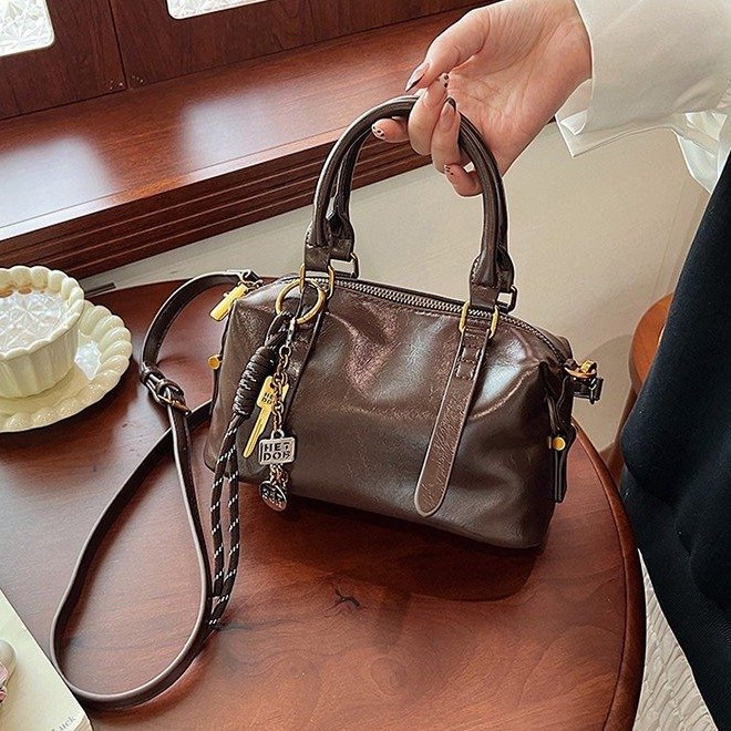 PU high-end soft leather hand-held Boston bag for women 2024 new versatile fashionable one-shoulder cross-body commuter bag
