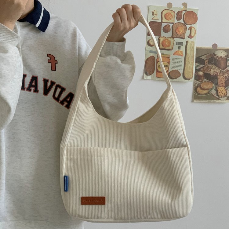 Simple large-capacity student tote bag spring new fashion simple shoulder bag portable casual class canvas bag