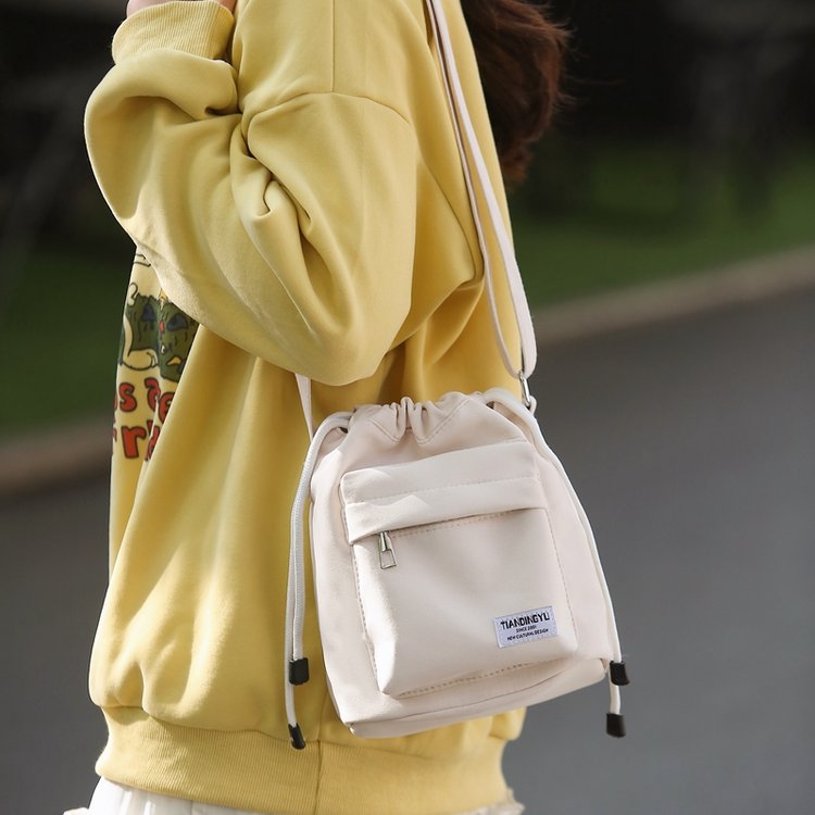 Women's bags Japanese and Korean niche design nylon drawstring shoulder bag simple and versatile bucket bag fashionable college style crossbody bag