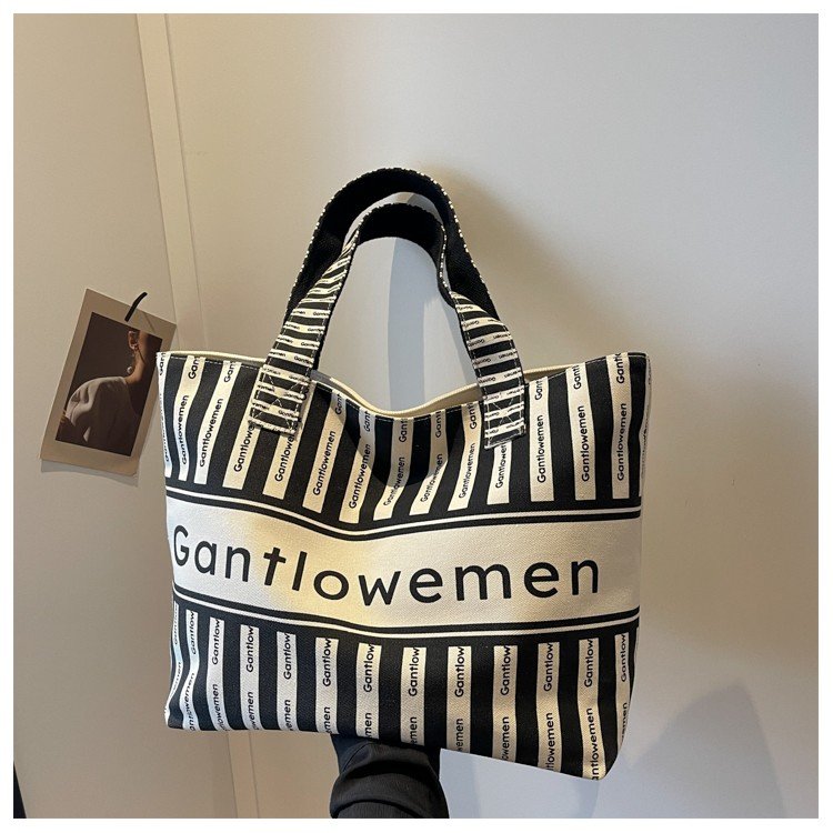 Cross-border wholesale literary lettered one-shoulder canvas tote bag new work commuting casual versatile portable shopping bag