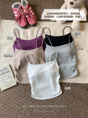 Pure and sexy hot girl wearing a suspender vest for women with a slim fit inside short top