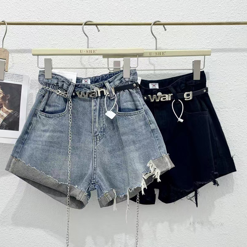 Sweet and spicy design elastic waist hot pants for women's summer specialty tassel fur irregular high waist denim shorts trendy