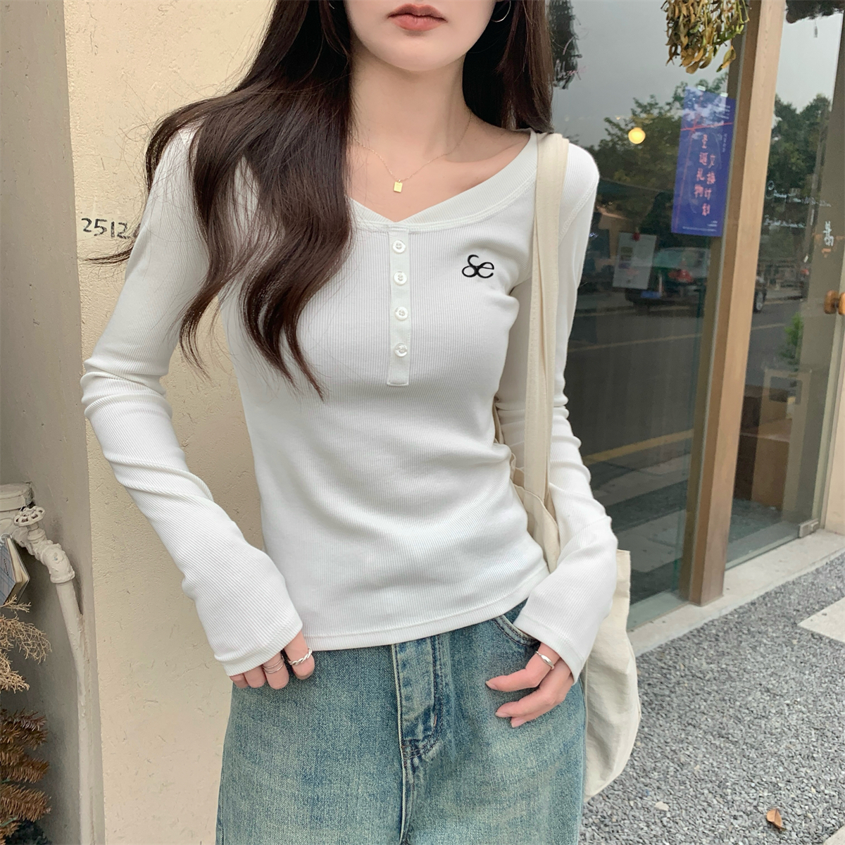 Real shot of the new spring slim temperament button embroidery design versatile pure cotton long-sleeved T-shirt women's top
