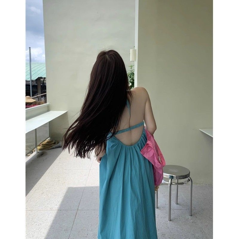 海邊度假風白色吊帶連衣裙女夏季性感露背寬鬆顯瘦沙灘掛脖長裙子
