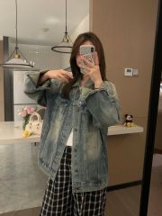 Vintage distressed blue rinsed and bleached slim fit American denim jacket casual outerwear for London streets