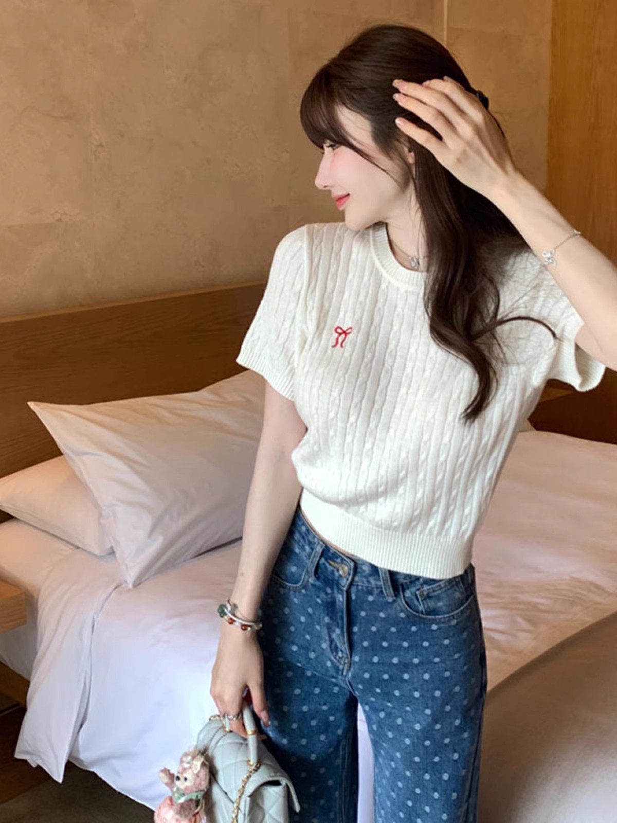 Round neck short-sleeved retro twist bow sweater women 2025 early spring new college style age-reducing versatile top