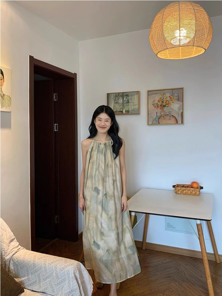 三亞海邊裙子法式寬鬆氣質連衣裙水墨暈染印花吊帶度假風沙灘裙夏
