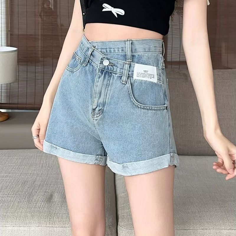 Korean version of irregular slanted jeans for women in spring and summer new high-waisted slimming ins curly versatile denim shorts