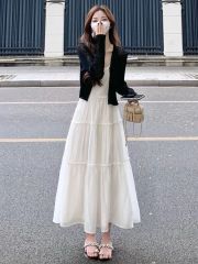 Spring and summer fashion set for 2025: sleek, figure-flattering black cardigan paired with a dreamy, princess-style dress&mdash;perfect for women.