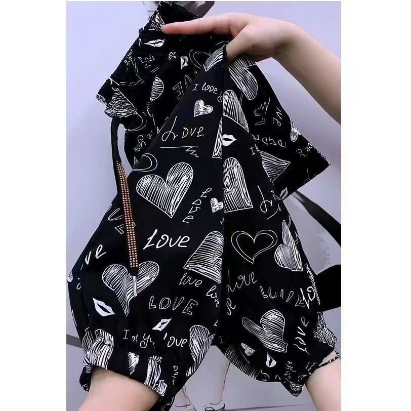 Ice silk pants for women in summer thin 2025 new flower pants fashionable flower outside casual pants quick-drying nine-point pants trendy