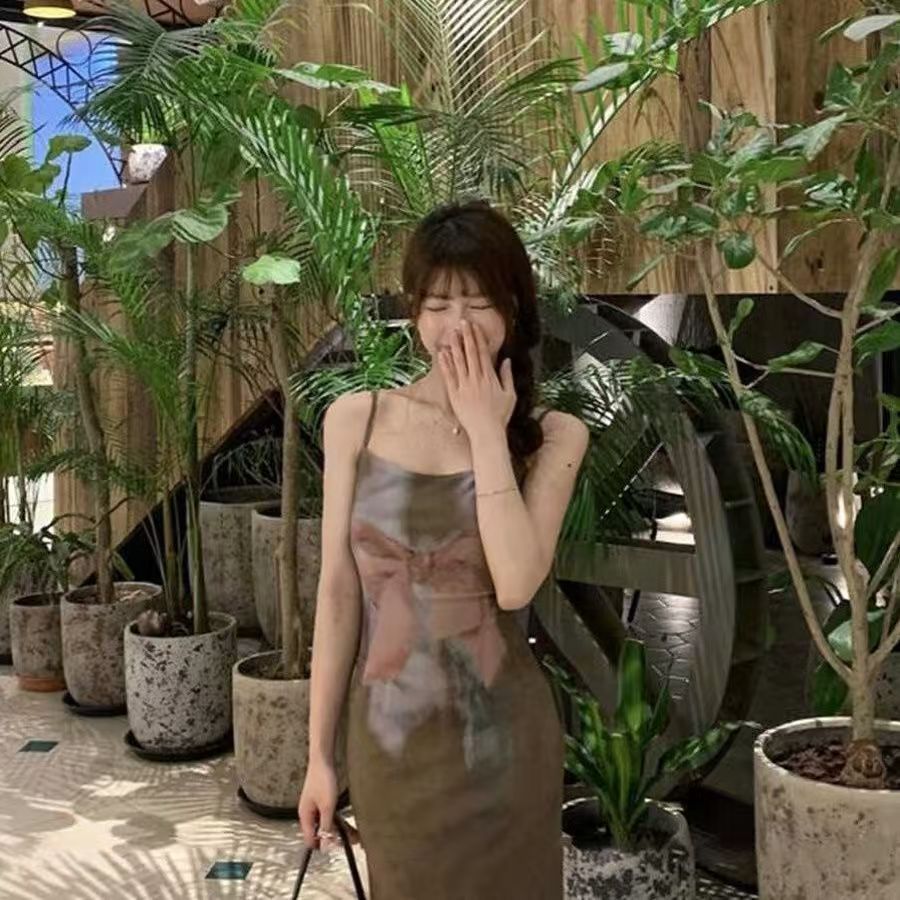 Lad retro bow printed suspender dress for women in summer 2025 new temperament slim slit long skirt