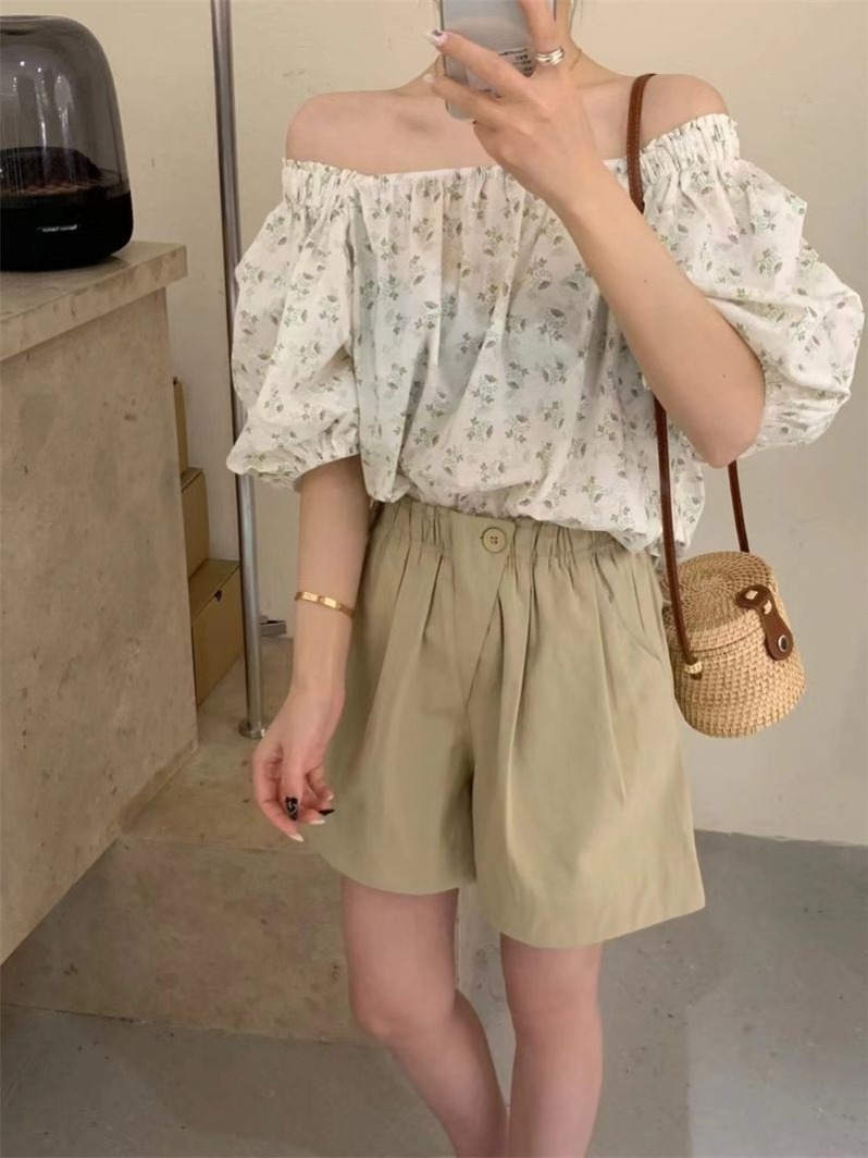 European products diagonal button casual shorts for women 2025 summer new style fashionable loose high waist A-line high elastic wide-leg hot pants for women