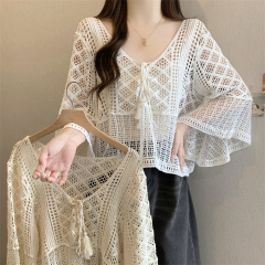 Summer flared sleeve vacation style hollow hook sweater women pullover lace-up blouse loose and versatile sun protection top
