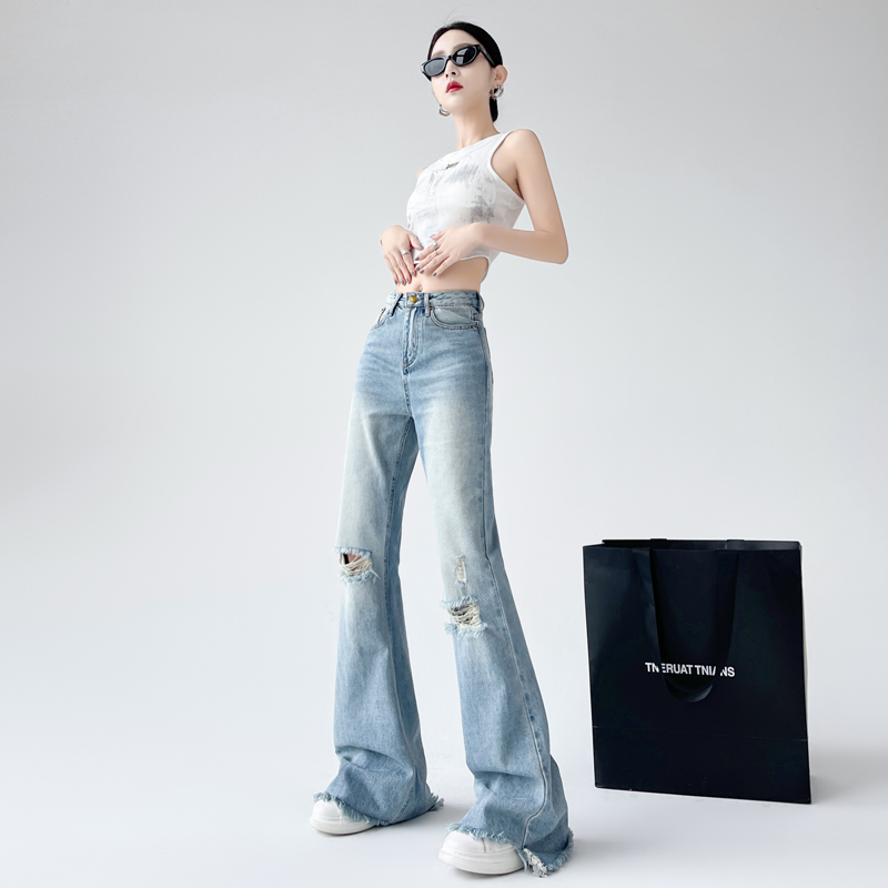 Blue washed ripped high-waisted slightly flared jeans for women slim slim fringe trousers