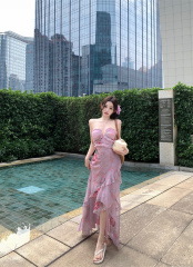 Real-shot vacation-style lilac-pink floral dress that creates a slimming effect.