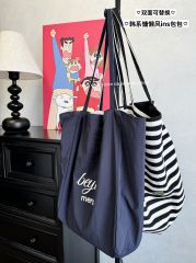 Real shot, large capacity, double-sided letter printed versatile shoulder bag, two-sided back striped bag