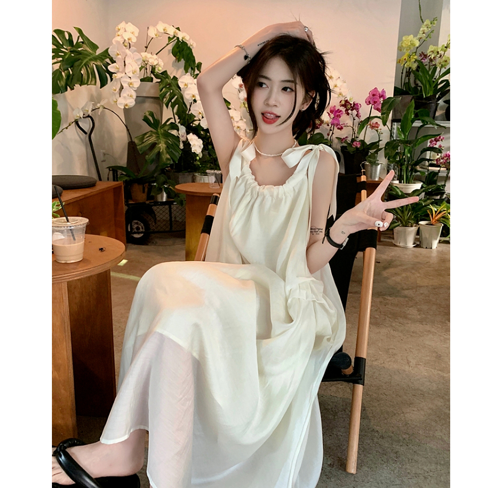 French gentle style suspender dress for women in summer 2025 new seaside vacation beach skirt niche long skirt