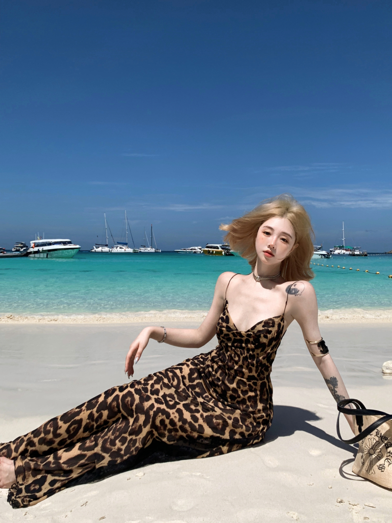 Real shot of retro leopard print sling collar suspender dress for women in summer sexy hollow backless design hip-packing long skirt