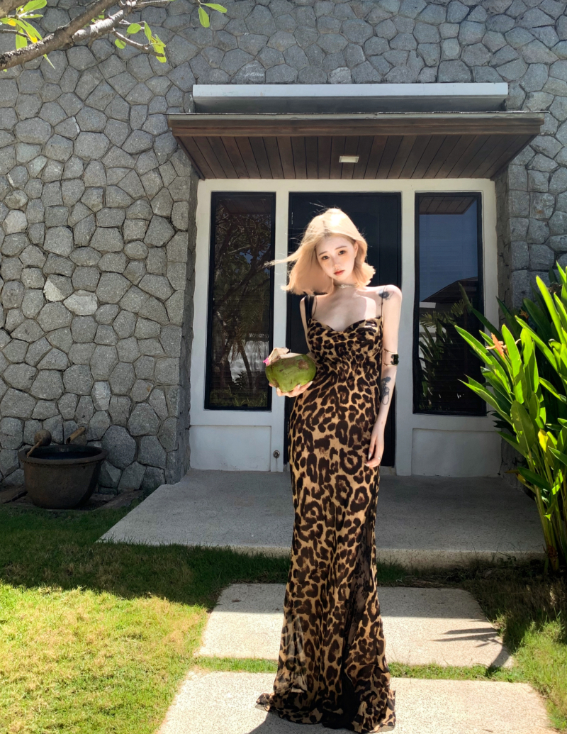 Real shot of retro leopard print sling collar suspender dress for women in summer sexy hollow backless design hip-packing long skirt