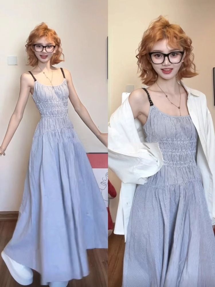 Blue suspender dress for women's summer 2025 new French beach vacation style beach waist-hugging long skirt
