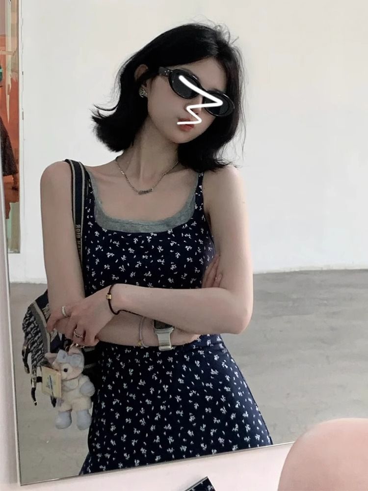 Fake two-piece sleeveless suspender floral dress for women's summer 2025 new seaside vacation high-end long skirt