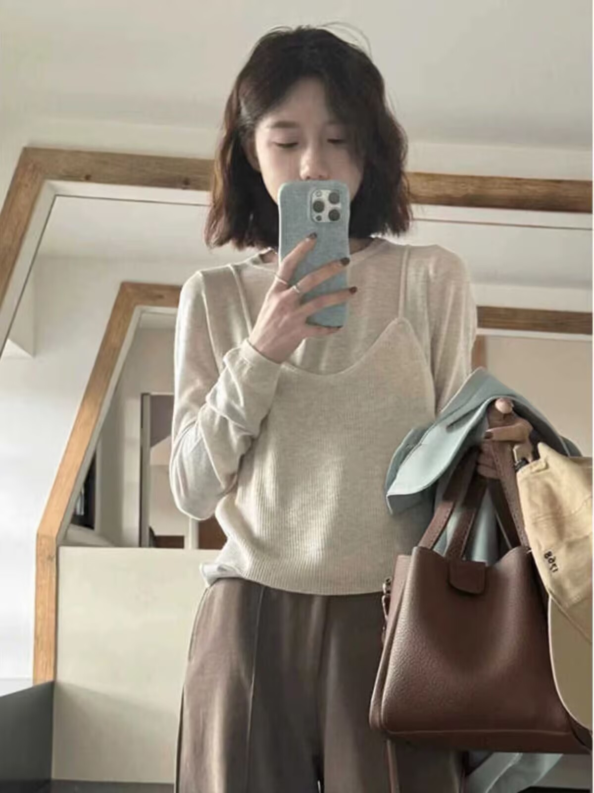 Korean version of fake two-piece design simple long-sleeved sweater for women early autumn new relaxed casual loose slim top