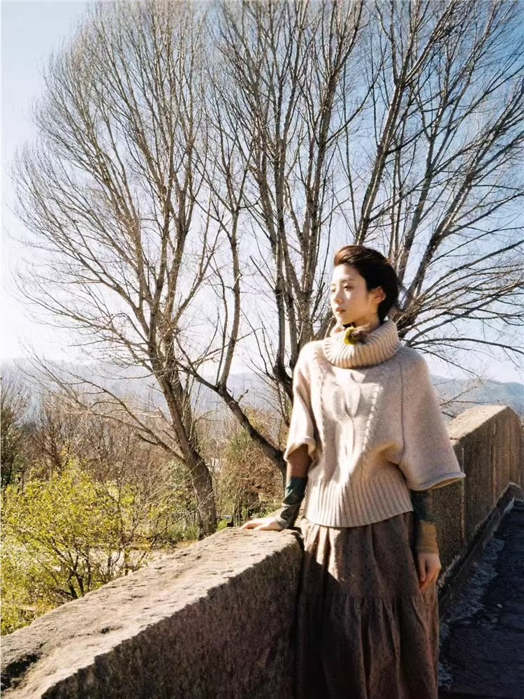 Twist pullover cloak sweater for women Korean style spring new lazy turtleneck design style versatile knitted top