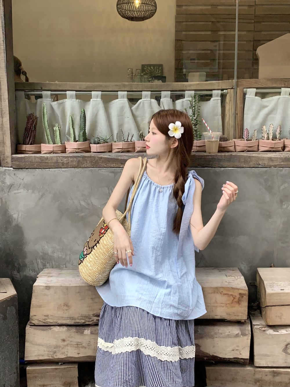 Real photo of blue suspender vest women wearing summer seaside outdoors with a sleeveless loose top